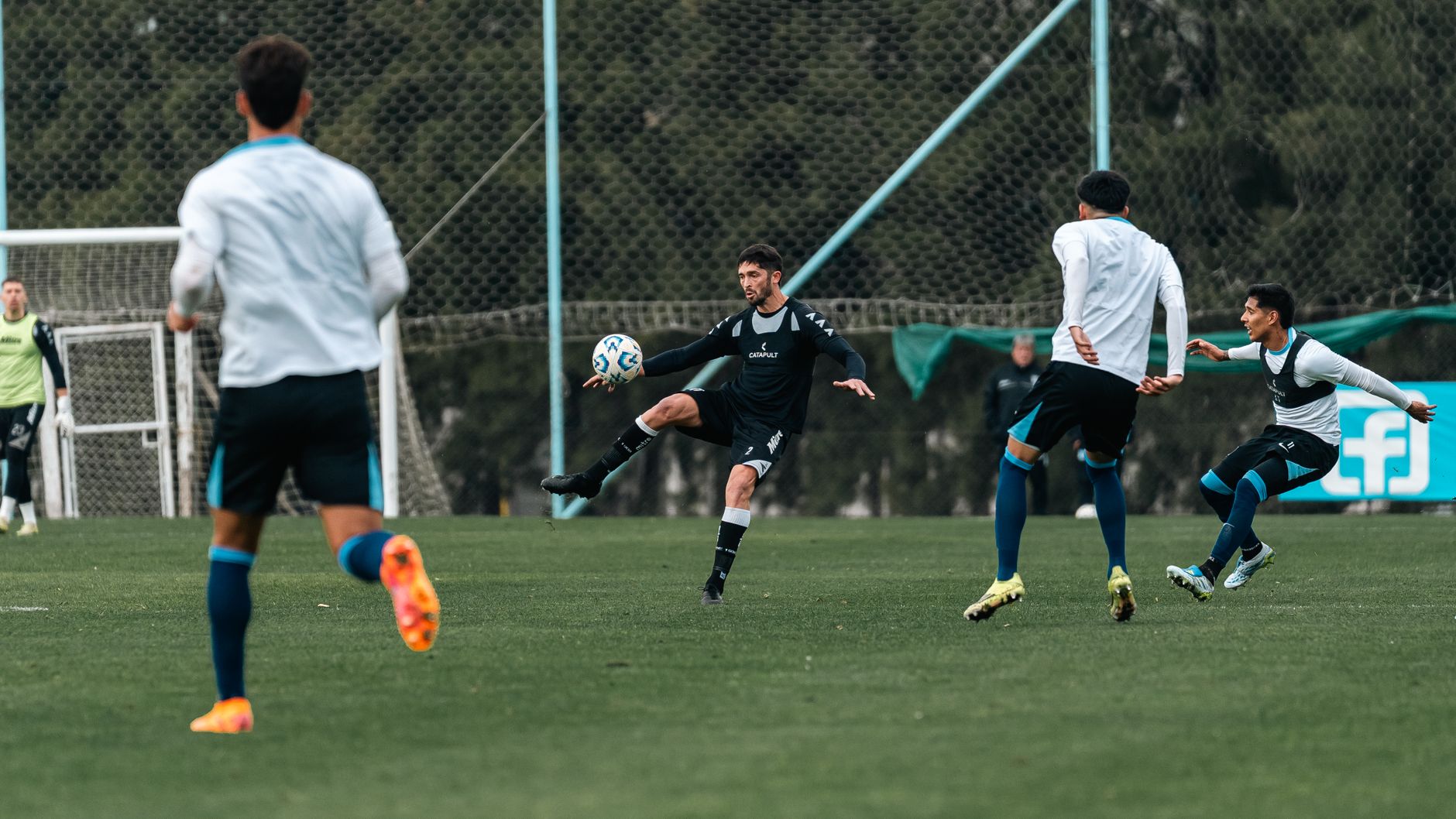Dynamic moment captured during a soccer match, showing athletes in action on the field.