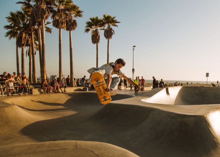 Captivating image of a skateboarder mid-air at a sunny Los Angeles skatepark.