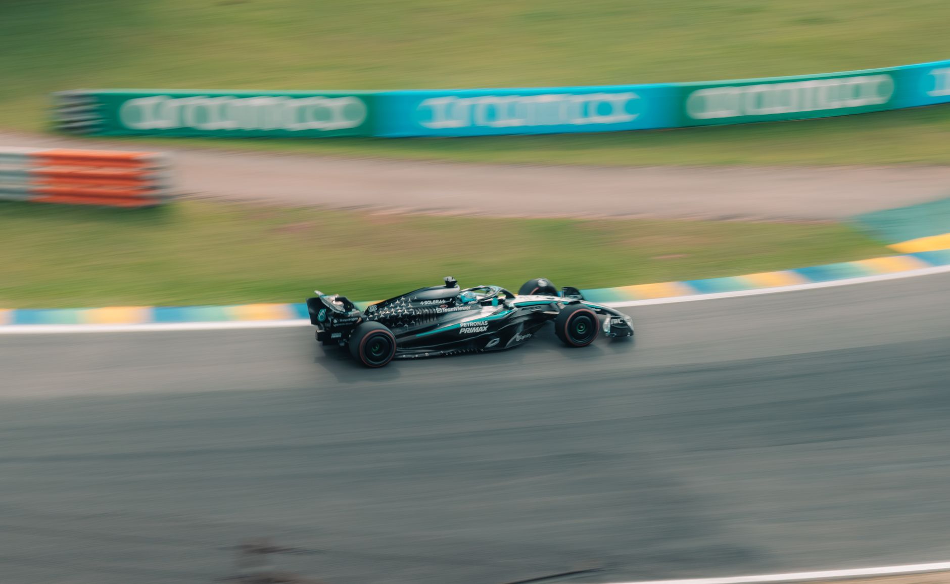 A race car spearing down a track in São Paulo, Brazil, showcasing speed and motion.