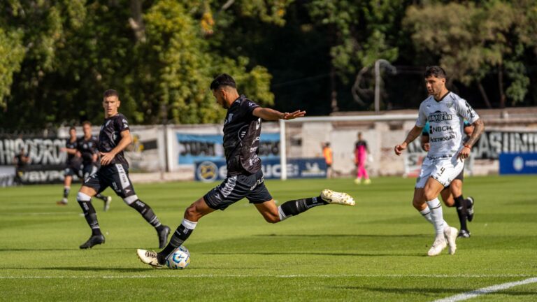 Exciting moment from a live football match with players in action on the field.