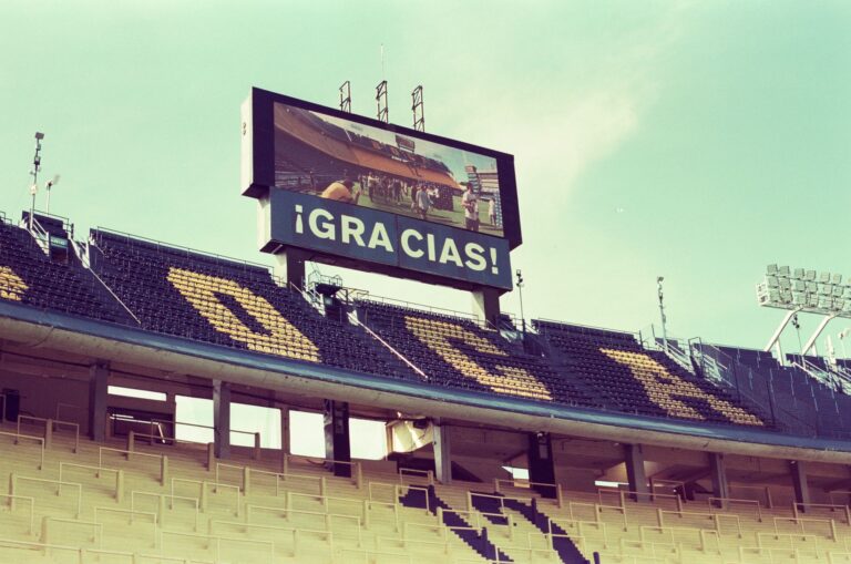 Empty La Bombonera stadium in Buenos Aires featuring a thank you message on the screen.