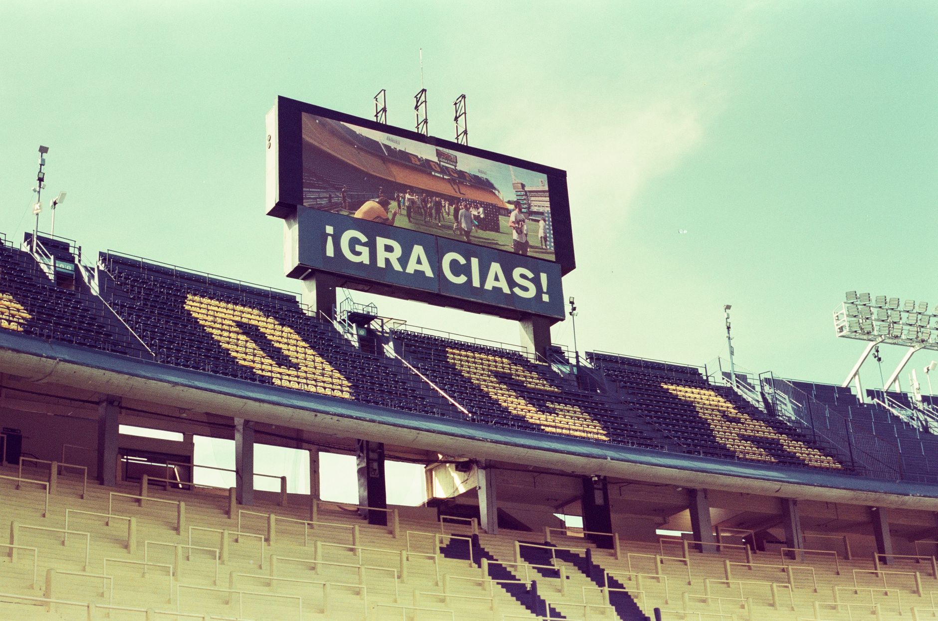 Empty La Bombonera stadium in Buenos Aires featuring a thank you message on the screen.