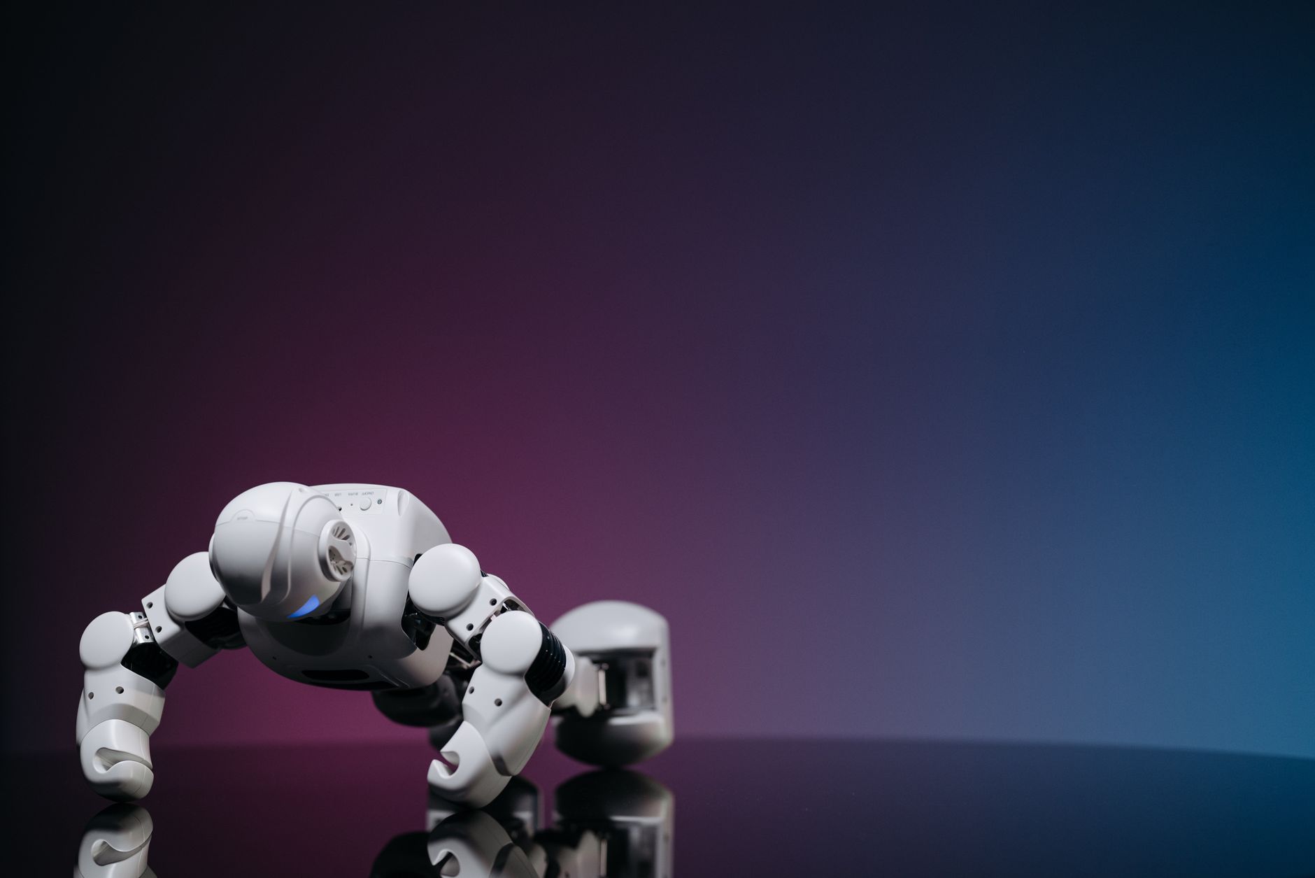 White robot doing push-ups on reflective surface, futuristic concept.