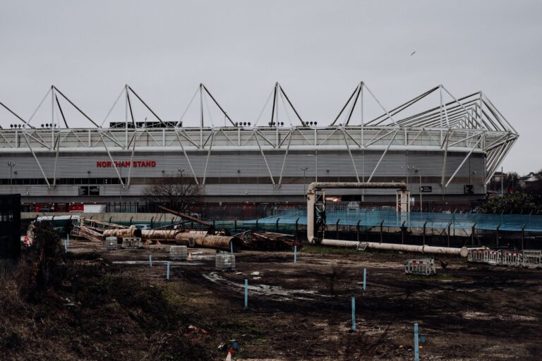 View of St Mary's Stadium's Northam Stand, Southampton across a construction site.