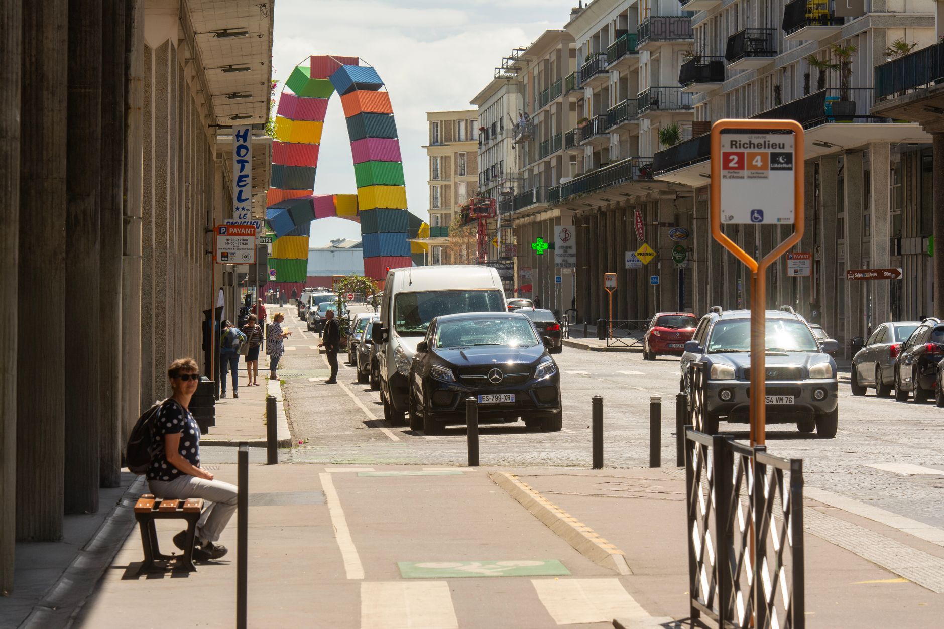 A vibrant street scene in Le Havre, France, featuring colorful urban sculptures and city life.