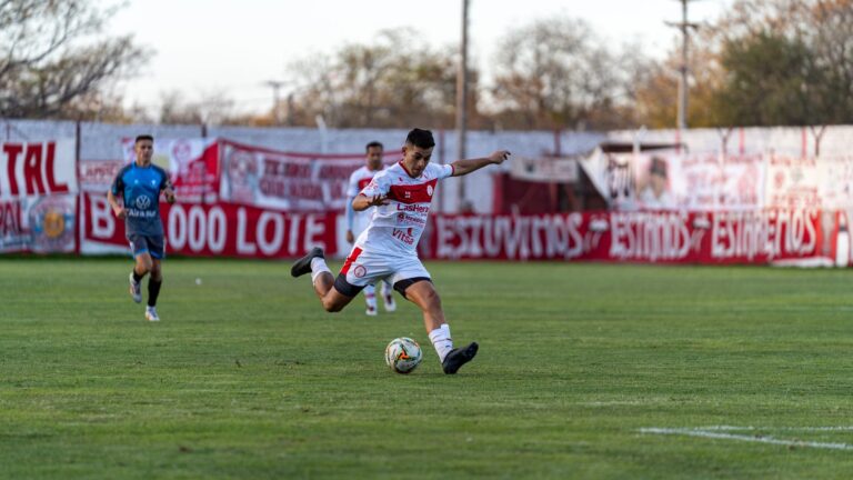 Soccer player in motion during a match, capturing the intensity of the game.