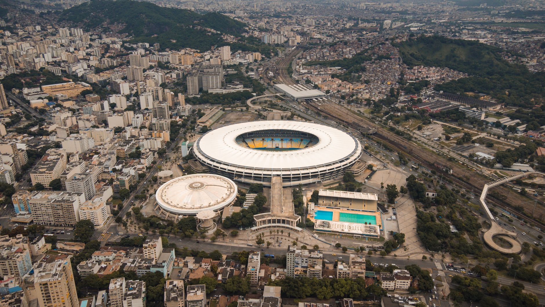 Aerial shot of the iconic Maracanã Stadium in bustling Rio de Janeiro, Brazil.