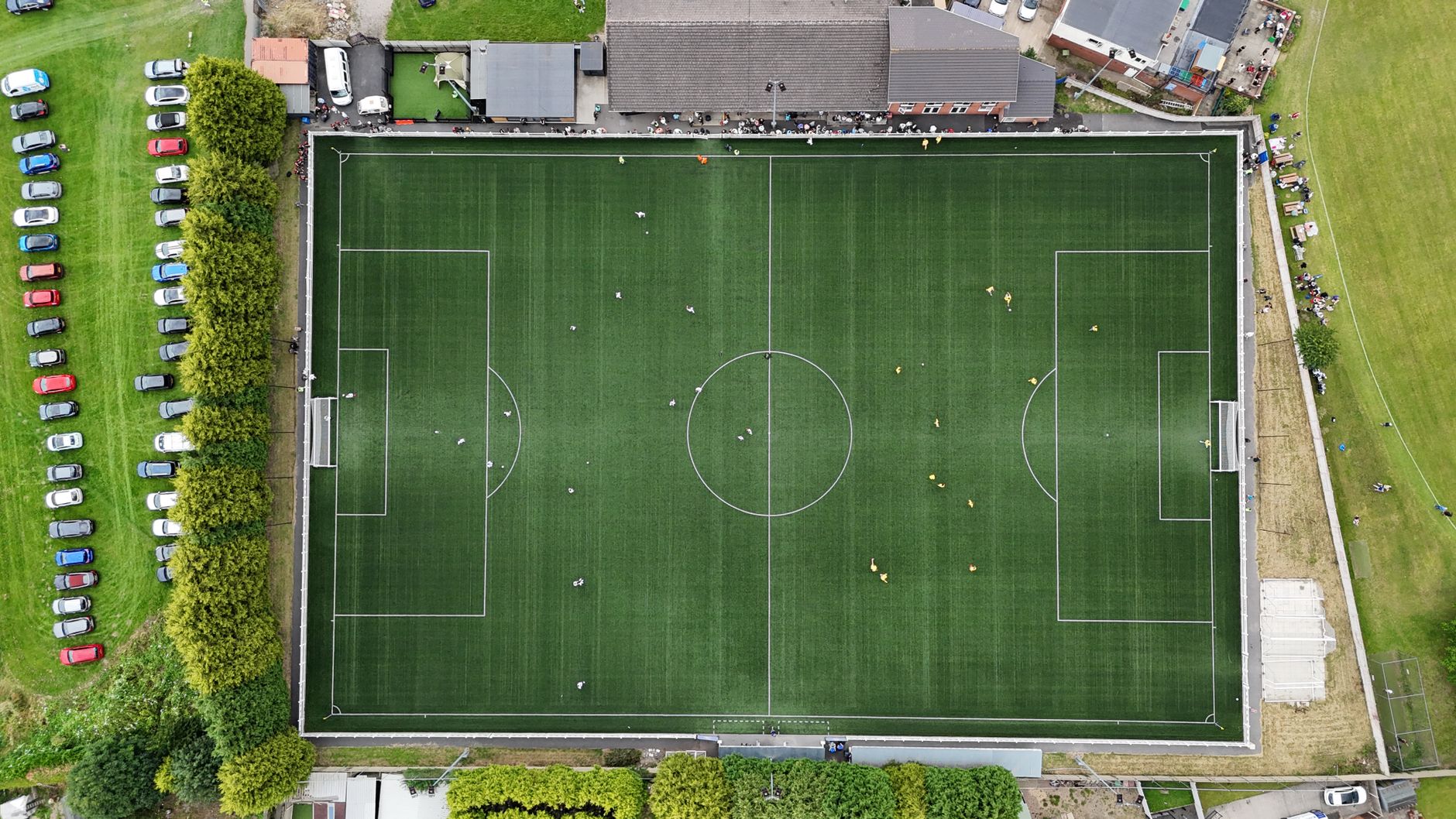 Aerial shot capturing a soccer match at a green football field in Fitzwilliam.