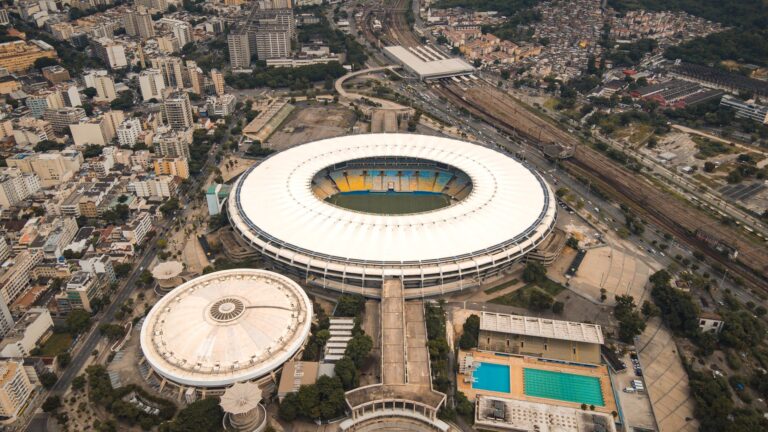 Drone shot of Maracanã Stadium and surrounding cityscape in Rio de Janeiro, Brazil.