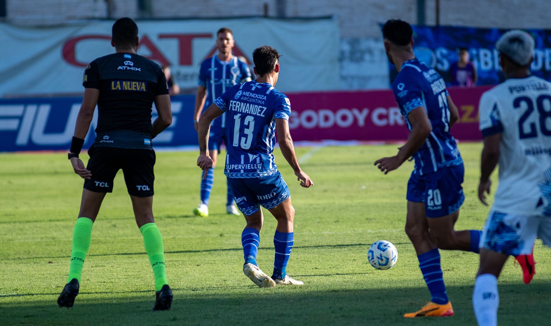 Action-packed soccer match between two teams, captured in a vibrant outdoor setting.