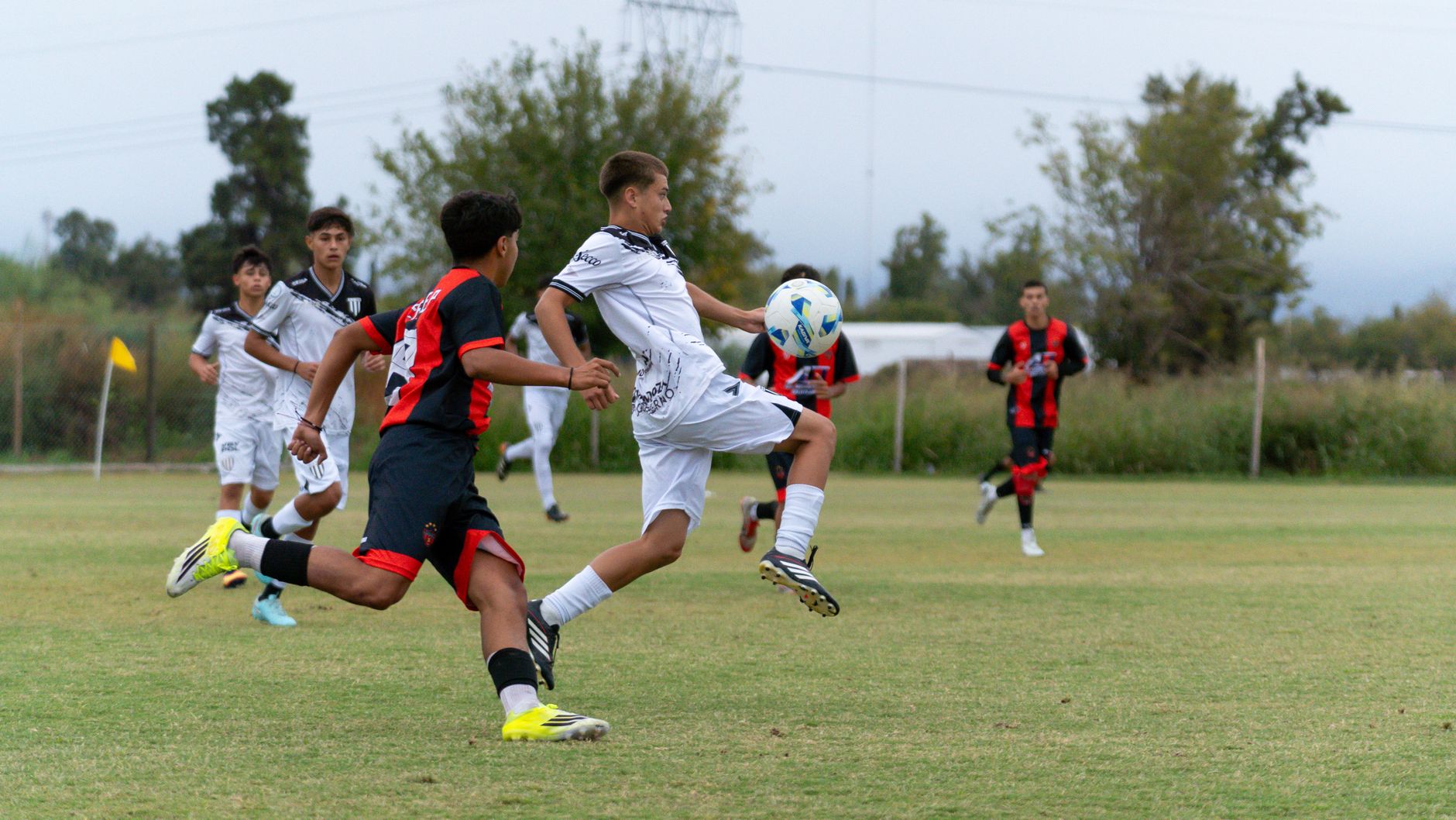 Action-packed youth soccer match on the field capturing player interactions and sportsmanship.